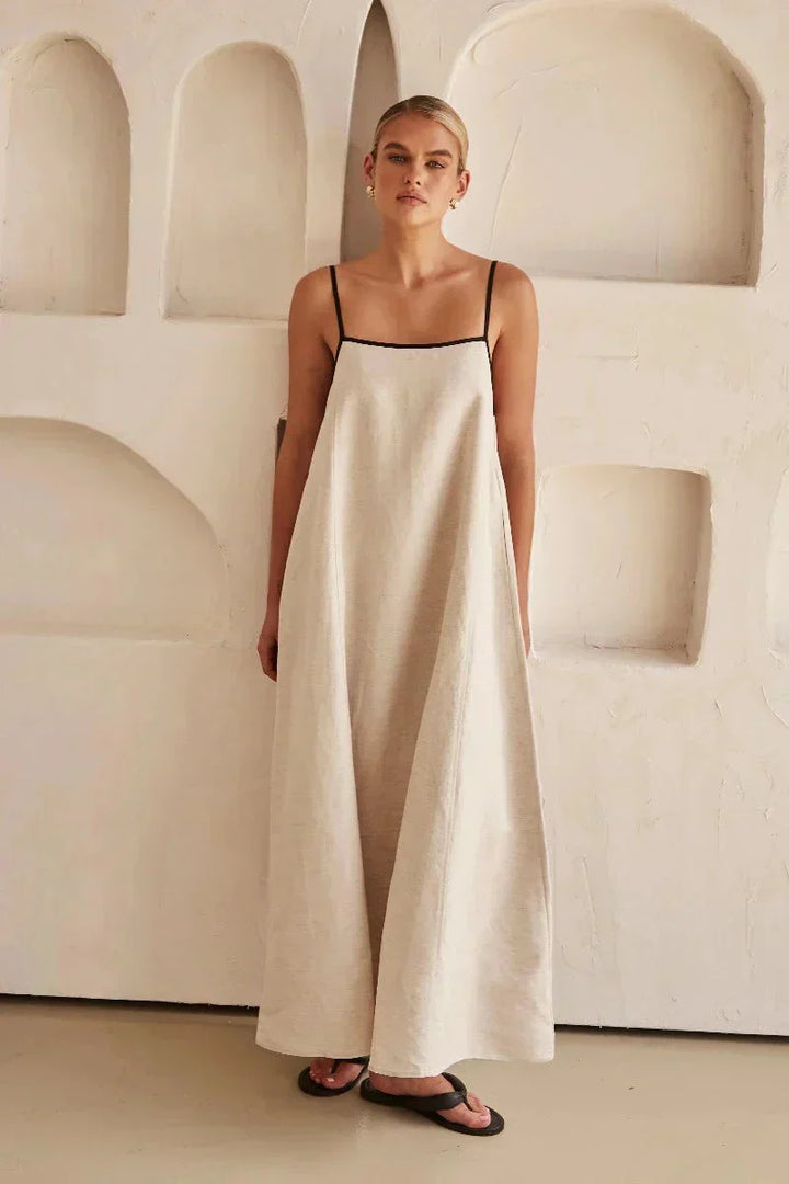 Lightweight women's sleeveless beige boho maxi dress, featuring a flowy design & linen-look for comfort.