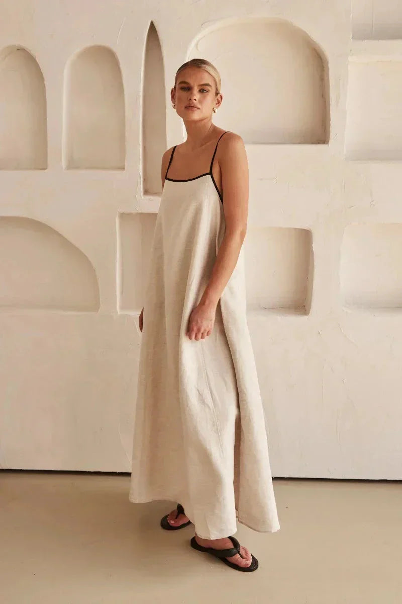 Chic women's sleeveless beige Elin maxi dress, a must-have flowy boho summer dress for any occasion.