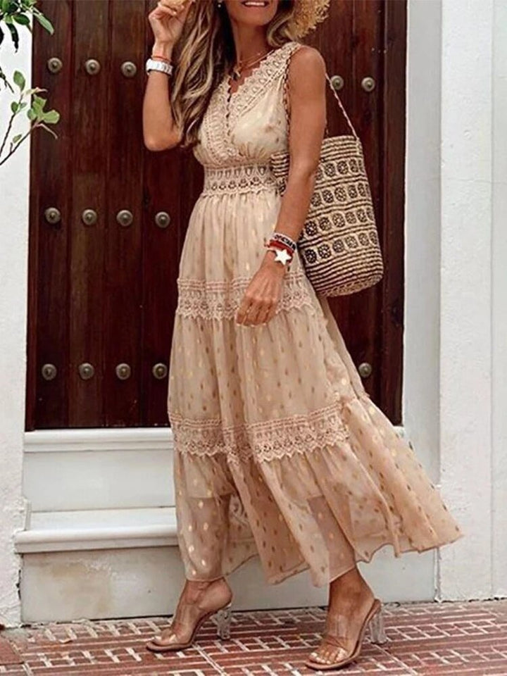 Close-up of a women's V-neck boho maxi dress, highlighting its airy, flowy fabric and intricate print details for summer.