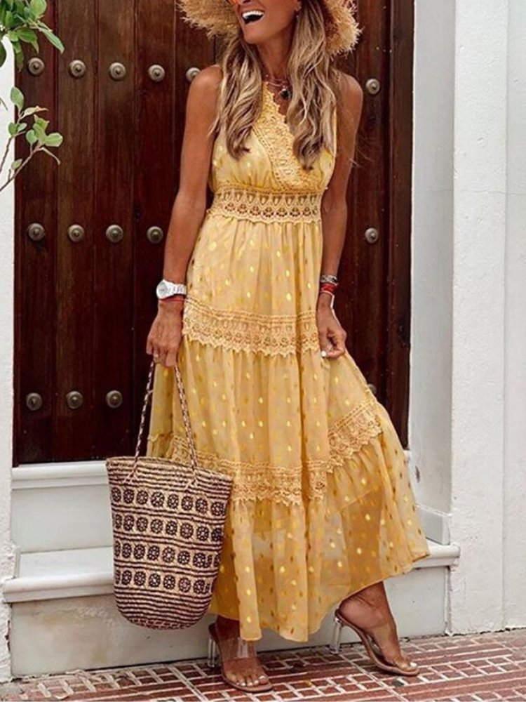 Woman in a flowy V-neck boho summer dress, perfect for beach vacations, resort wear, or effortless casual style.