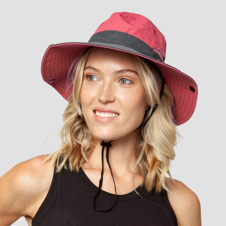 Adjustable & breathable women's sun hat, foldable wide brim, UV protection, and ponytail slot for comfort.
