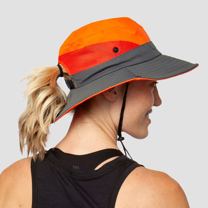 Women's foldable sun hat: UV protection (UPF 50+), wide brim, breathable, & ponytail opening for summer.