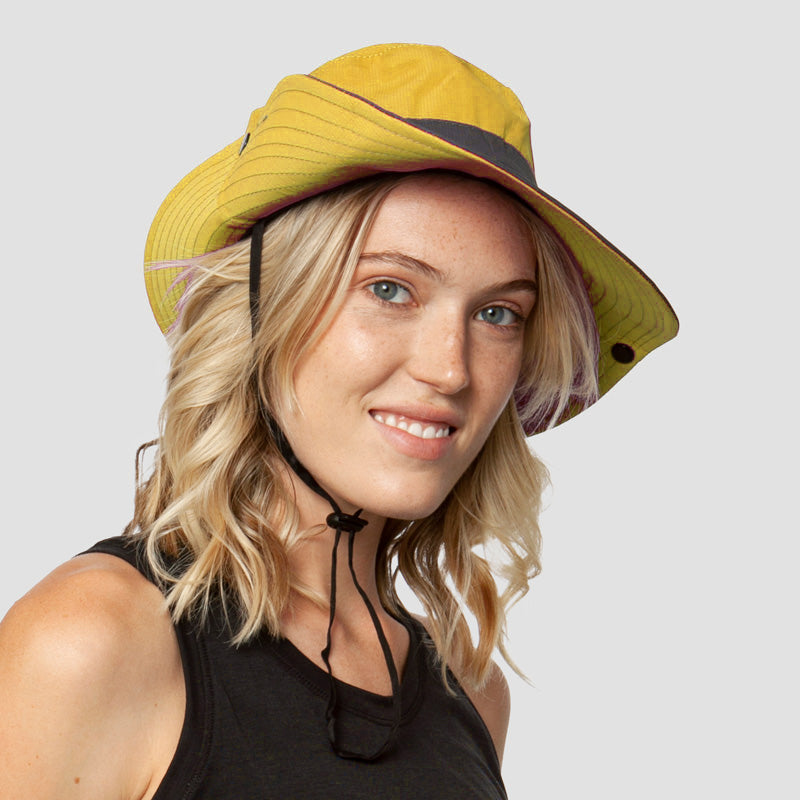 Women's ponytail sun hat, foldable wide brim, UPF 50+ UV protection. Ideal for beach, travel, and sports.