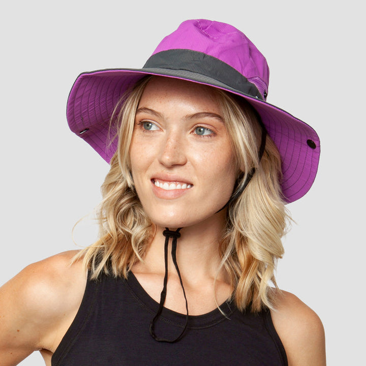 Quick-dry women's sun hat with foldable wide brim & ponytail opening. UPF 50+ UV protection for active women.