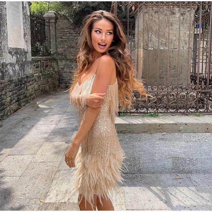 Women's exquisite sequin party dress, a short cocktail length with a sophisticated feather hem.