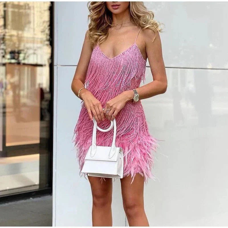 Dazzling women's sequin and feather evening gown; perfect for parties, dances, and formal events.