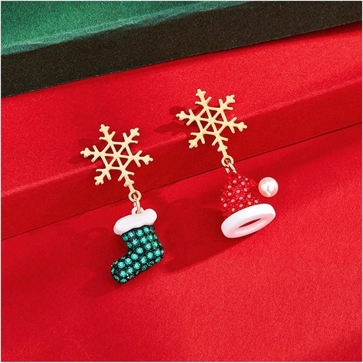 Close-up of gold-plated snowflake Christmas earrings. Festive women's jewelry with dazzling sparkle, ideal for holidays.