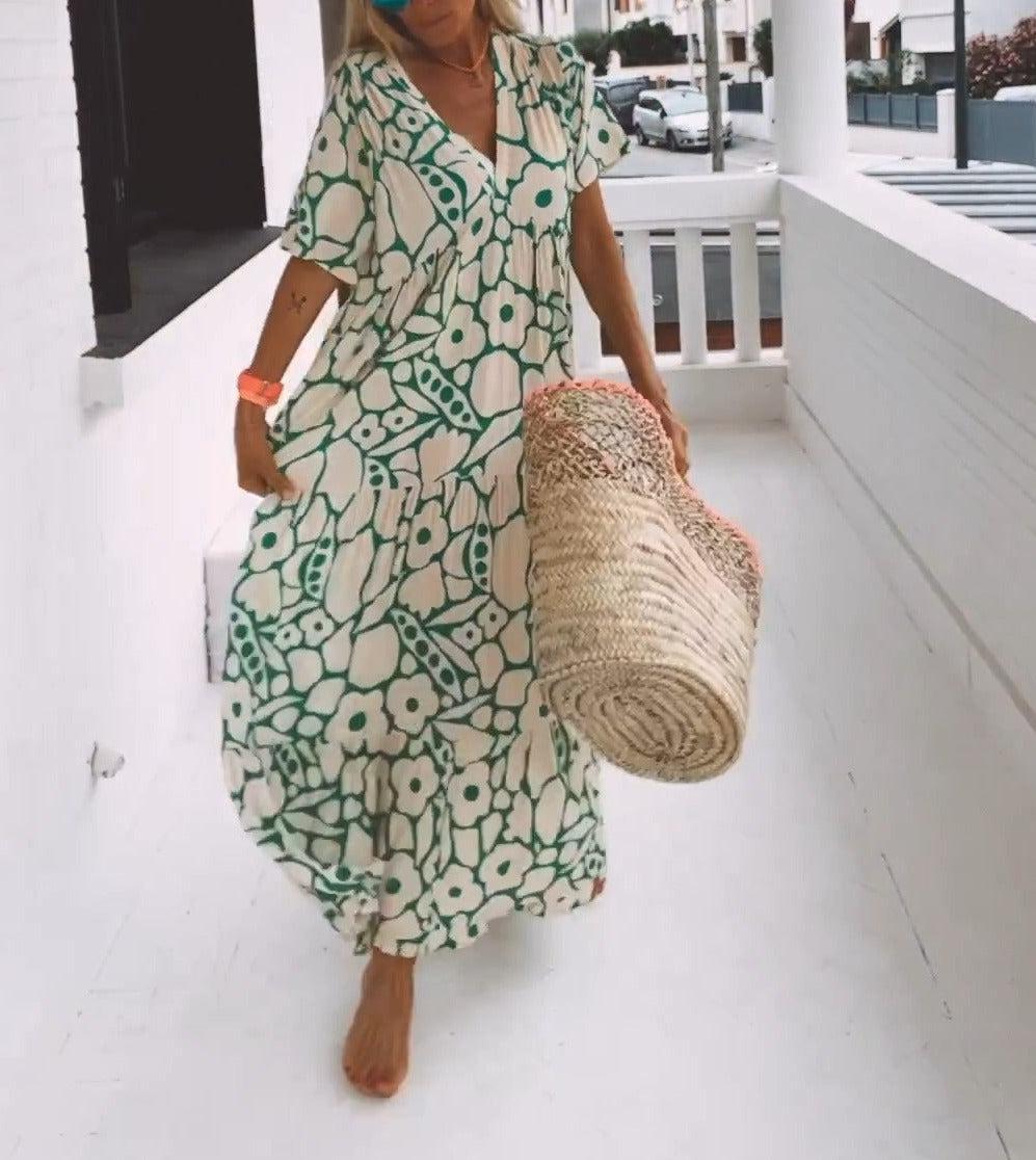 Elegant women's A-line green floral print maxi dress. Features short sleeves, V-neck, ideal for summer.
