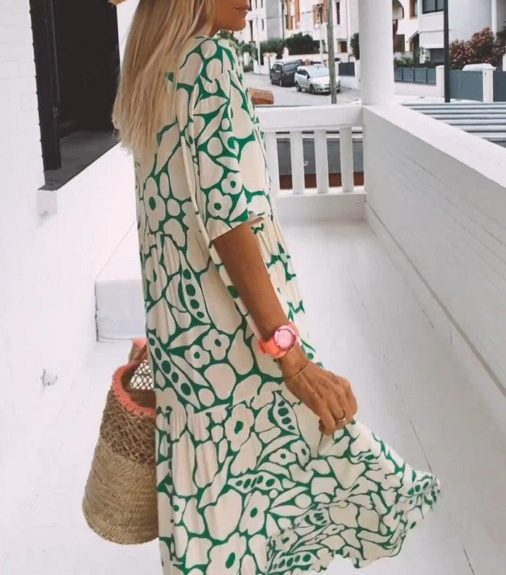 Comfortable short sleeve green floral maxi dress for women. Versatile design for day or evening events.