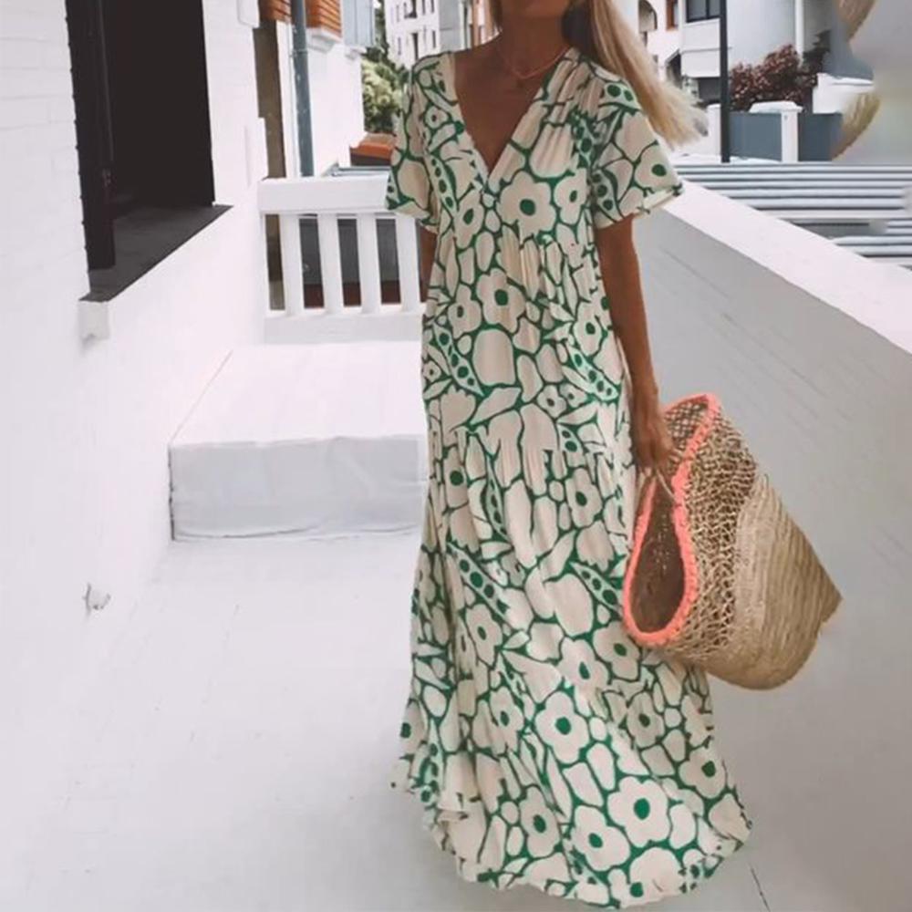 Stylish green floral short sleeve maxi dress for women. A comfortable V-neck summer dress with an A-line cut.