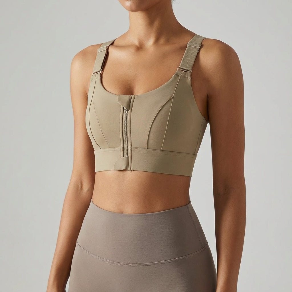 A woman wearing a black zip-front sports bra during a yoga pose, emphasizing comfort and support.