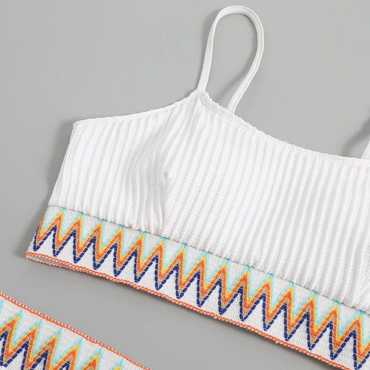 Elegant women's high waist bikini featuring adjustable straps. This two-piece swimsuit offers a flattering summer look.