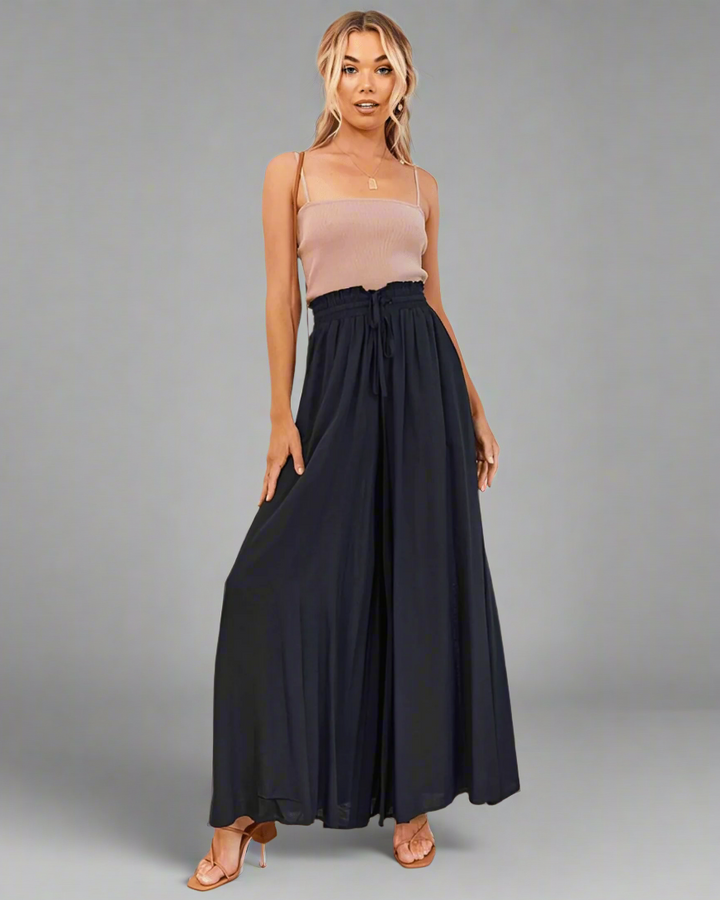 Mira lightweight high-waisted summer trousers with a drawstring, ideal for comfortable vacation outfits.