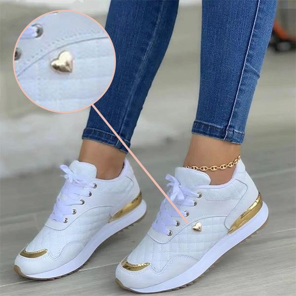 Isla women's trendy sneakers in white, featuring breathable design and cushioned sole for comfort.