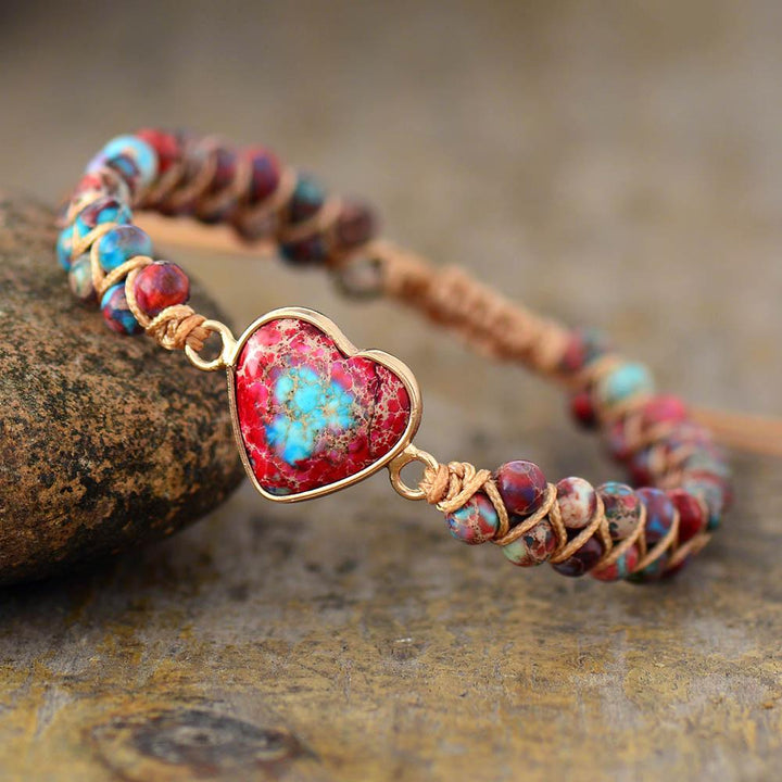 Close-up of women's Jasper gemstone bracelet, showing unique patterns & vibrant colors of beads