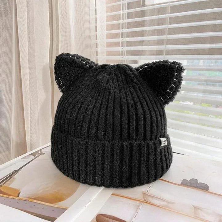 Cute women's beanie with cat ears, hand-knitted for winter warmth, fashionable accessory