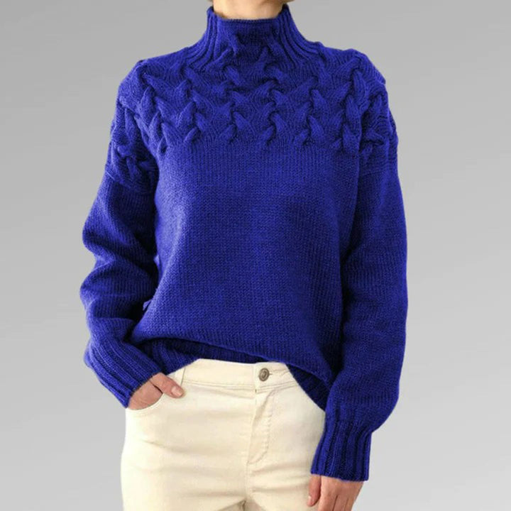 Woman wearing an elegant knitted turtleneck sweater, showcasing classic style for winter fashion.