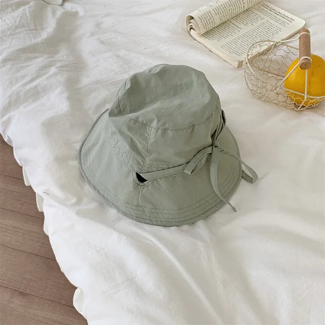 Aislyn women's sun protection hat, stylish lace-up bucket hat for summer fashion.