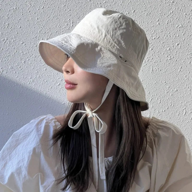 Summer-ready women's lace-up fisherman hat, perfect for outdoor activities & sun defense.
