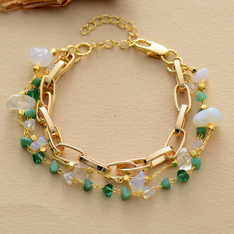 Handcrafted women's layered bracelet showcasing vibrant turquoise and iridescent opal gemstones.