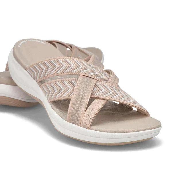 Cushioned women's comfort slippers with shock-absorbing soles & arch support, perfect for all-day wear.
