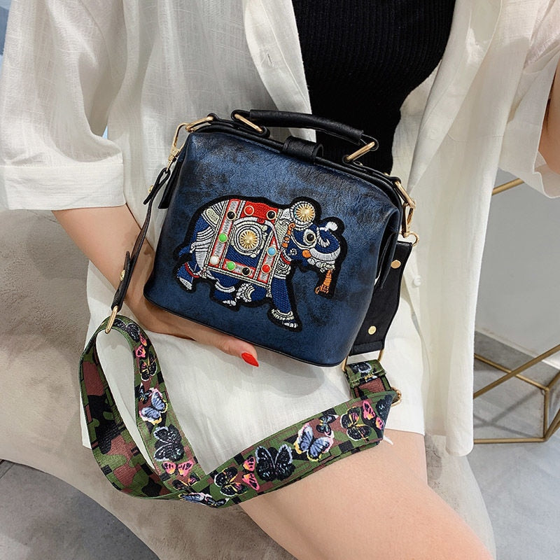 Bohemian women's crossbody bag with intricate mandala embroidery. Lightweight PU coated cotton.