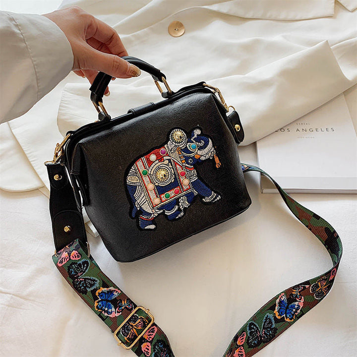 Women's lightweight bohemian handbag with intricate mandala embroidery. PU coated cotton.