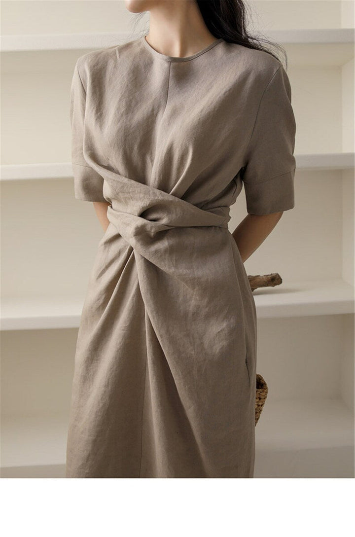 Fashionable women's khaki midi summer dress, sleeveless and lightweight with a customizable adjustable waist.