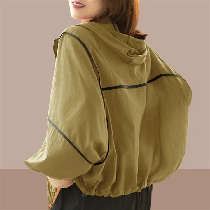 Stylish women's oversized hooded jacket for summer; versatile, casual, and perfect for a relaxed everyday fashion look.