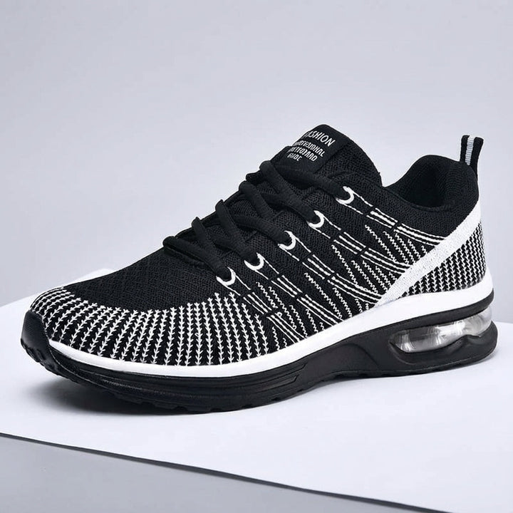 Close-up of women's pink sports trainers, lightweight design, breathable fabric for athletic activities