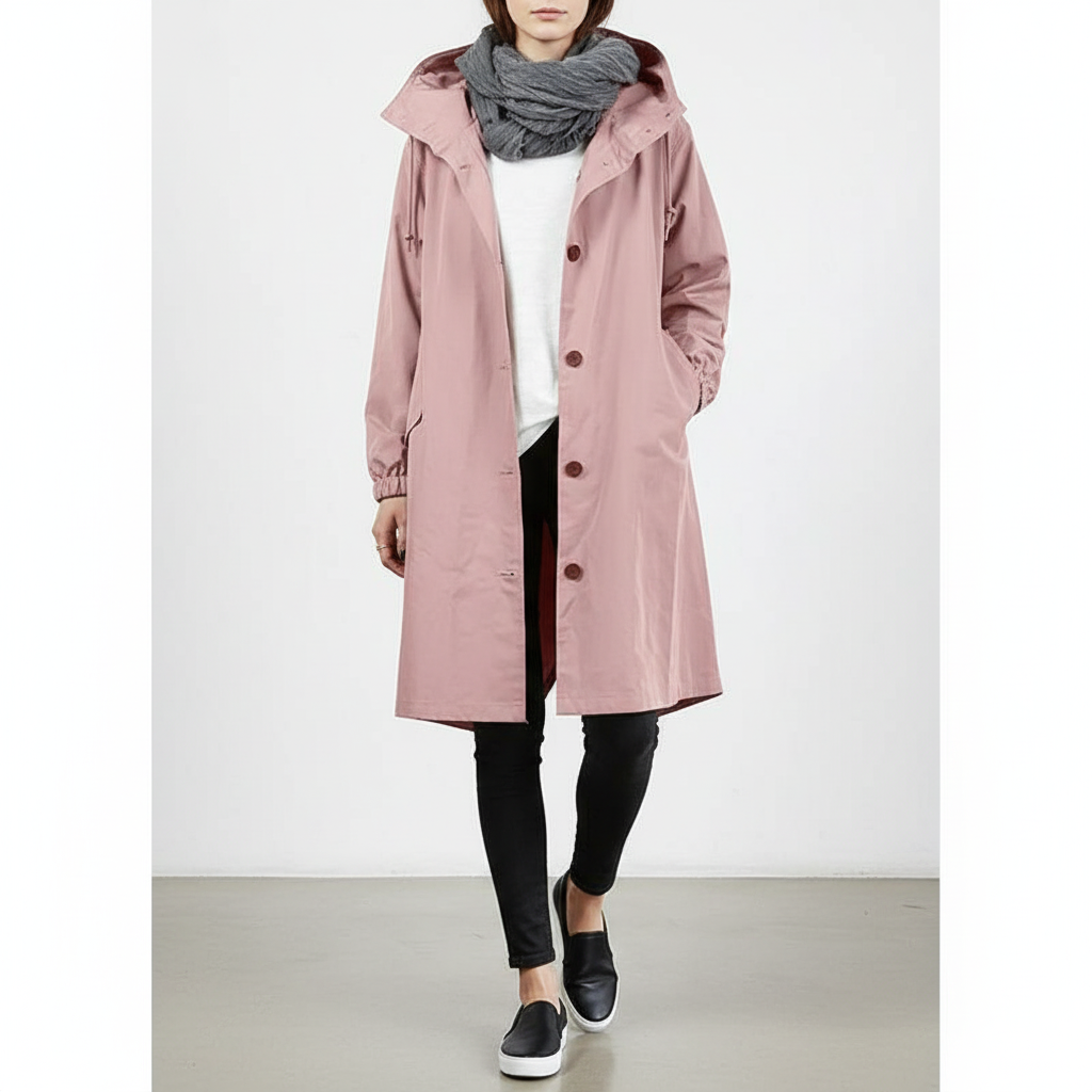 Stylish women's lightweight rain jacket in a vibrant color, water-repellent and travel-friendly