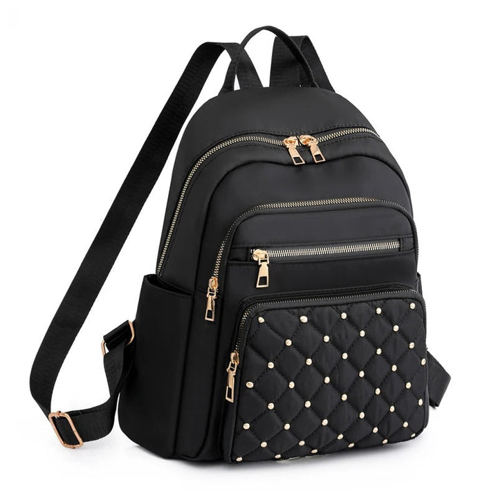Women's lightweight water-resistant nylon backpack, perfect for travel & school. Stylish daily carry bag.