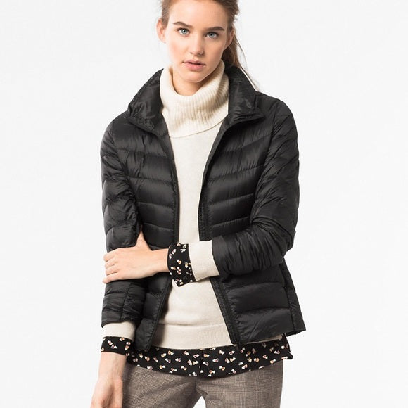 Women's lightweight down puffer jacket, waterproof for warmth without bulk in any season.