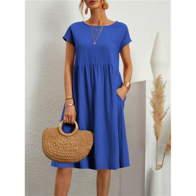 Woman enjoying summer in her Livia jersey dress. Comfortable, stylish, and perfect for warm-weather adventures.