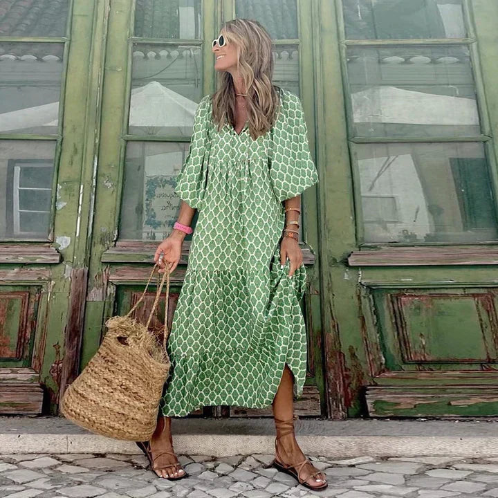 Women's loose fit boho summer dress, Ibiza style. Flowy fabric, perfect for vacation, beach, or casual wear.