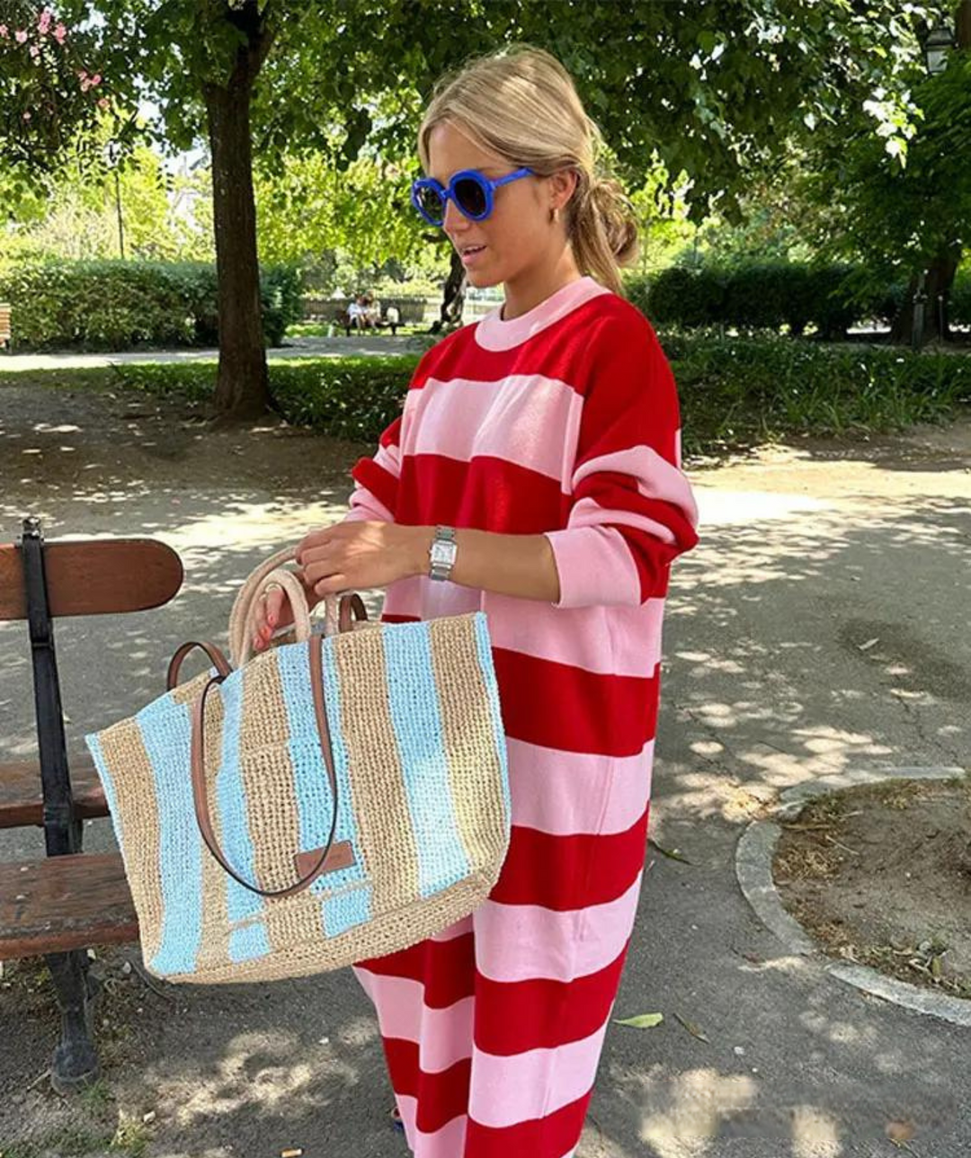Chic women's sleeveless striped midi dress with a loose fit, ideal for casual summer days and vacation wear.