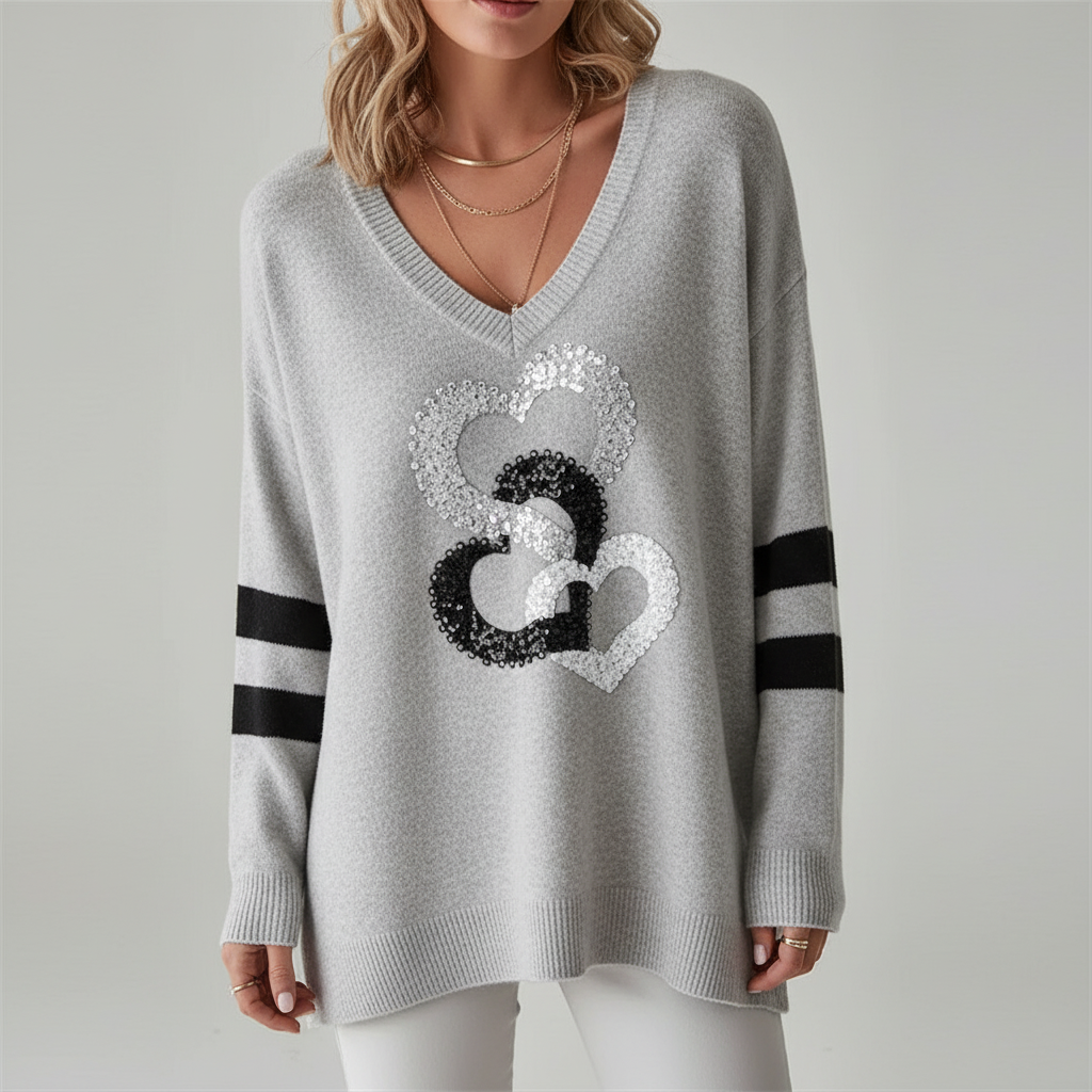 Warm winter wear: women's V-neck sweater with an elegant heart knit, loose and comfortable.