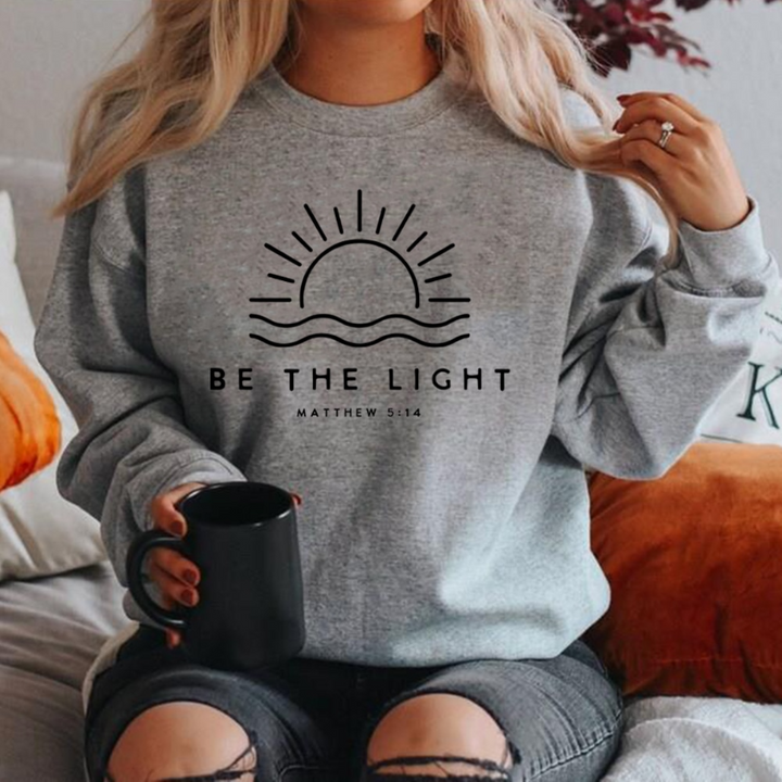 Casual women's long sleeve Shine Bright sweater. Empowering message & cozy knit for versatile everyday fashion.