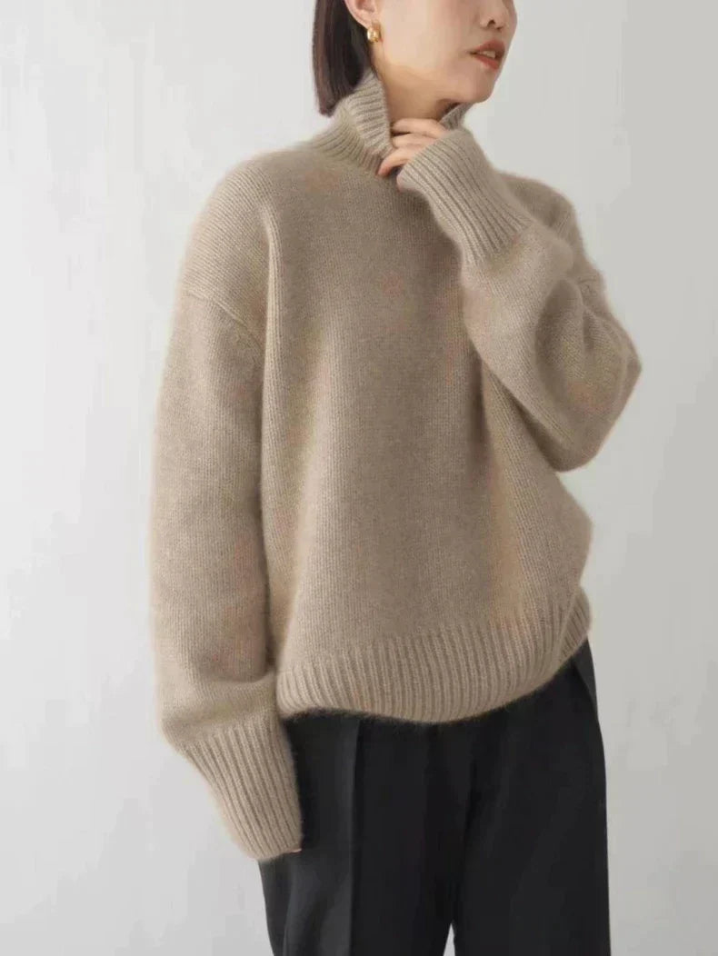 Close-up of a premium women's cashmere turtleneck sweater, showcasing its soft, luxurious texture and quality knit.