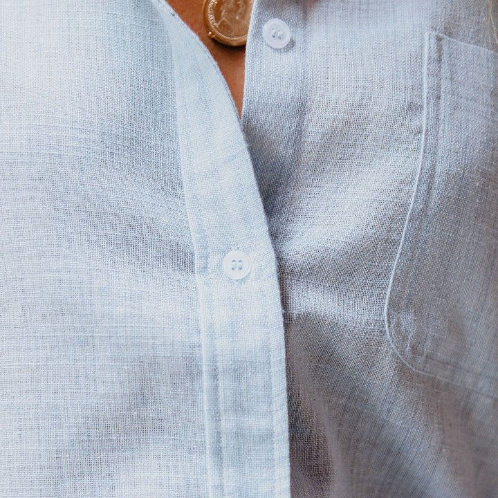 Casual women's linen-cotton long sleeve shirt. Features stand-up collar & practical chest pocket.