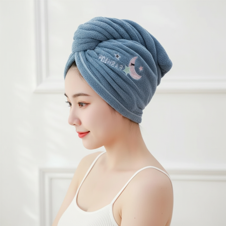 Woman with wet hair wearing a pink microfiber hair wrap, demonstrating hands-free drying