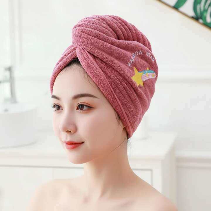 High-angle view of a pink microfiber hair turban, designed for quick and gentle hair drying
