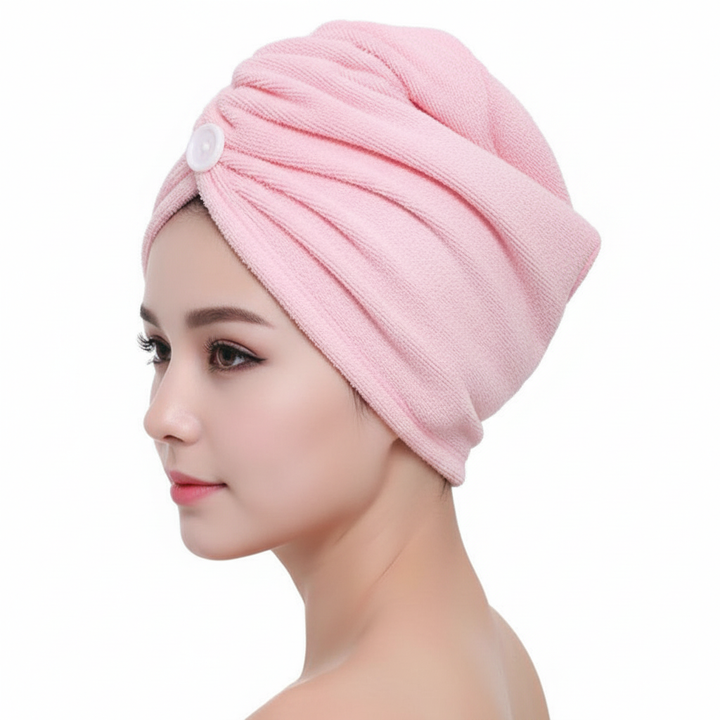 Woman with long hair wearing a pink microfiber hair wrap, demonstrating its quick-dry benefits