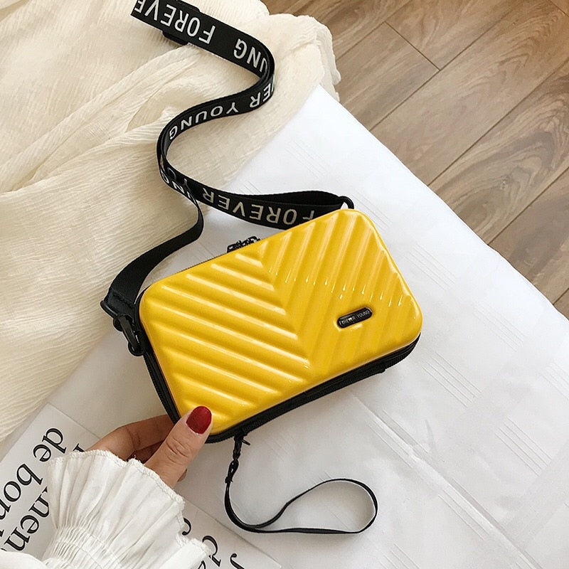 Hard shell pvc mini bag in black for women, elegant travel and fashion accessory