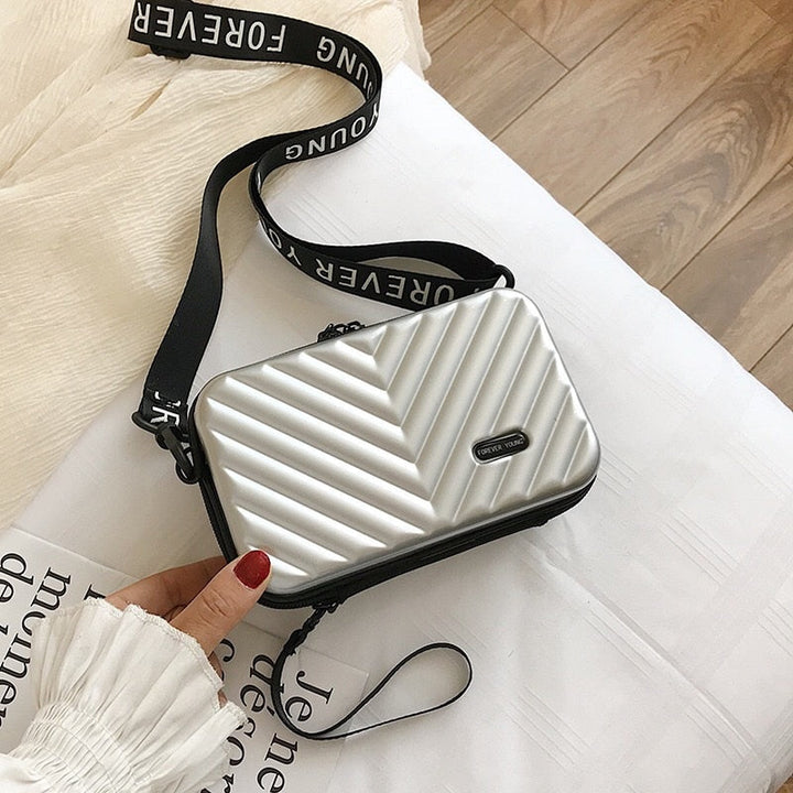 Black hard shell mini handbag for women, versatile crossbody travel accessory