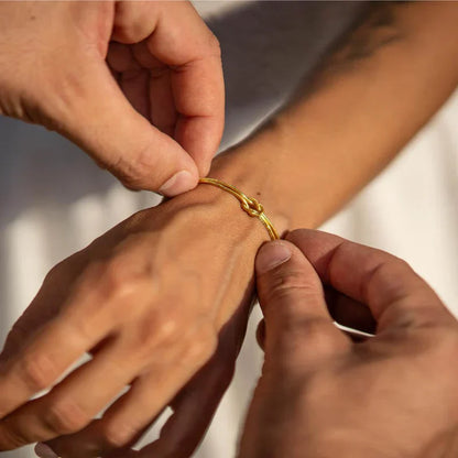 Simple yet elegant gold knot bracelet, perfect for the minimalist woman.