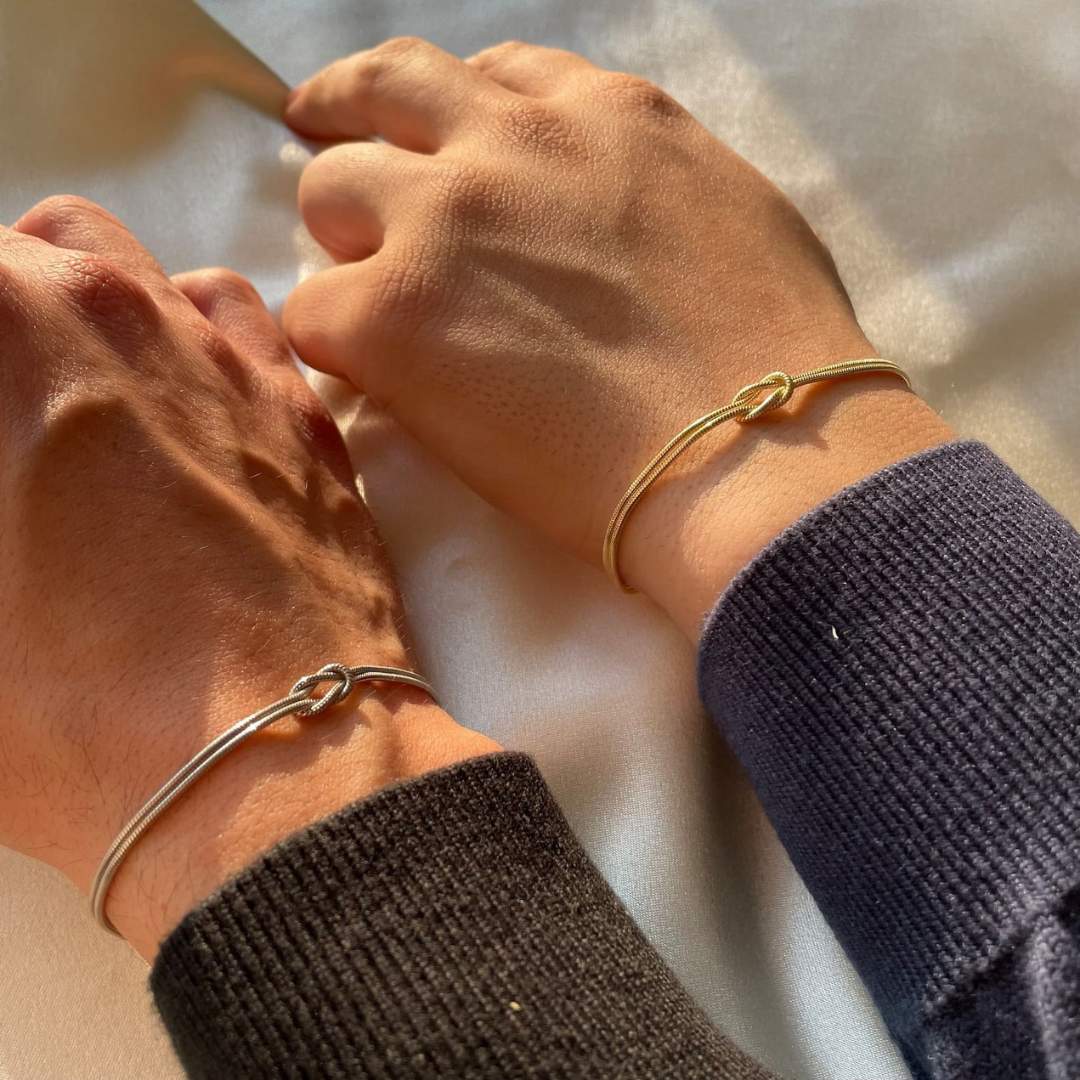 Women's subtle gold knot bracelet, a versatile addition to any jewelry collection.