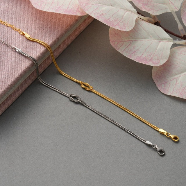 Classic gold knot bracelet, minimalist design offering timeless appeal.