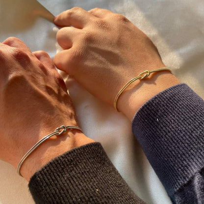 Chic gold knot bracelet, minimalist design perfect for women's everyday wear.