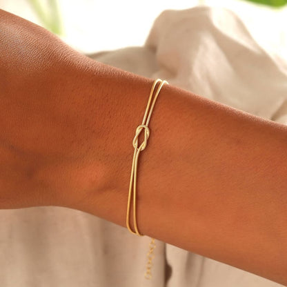 Versatile women's gold minimalist knot bracelet, perfect for any occasion.